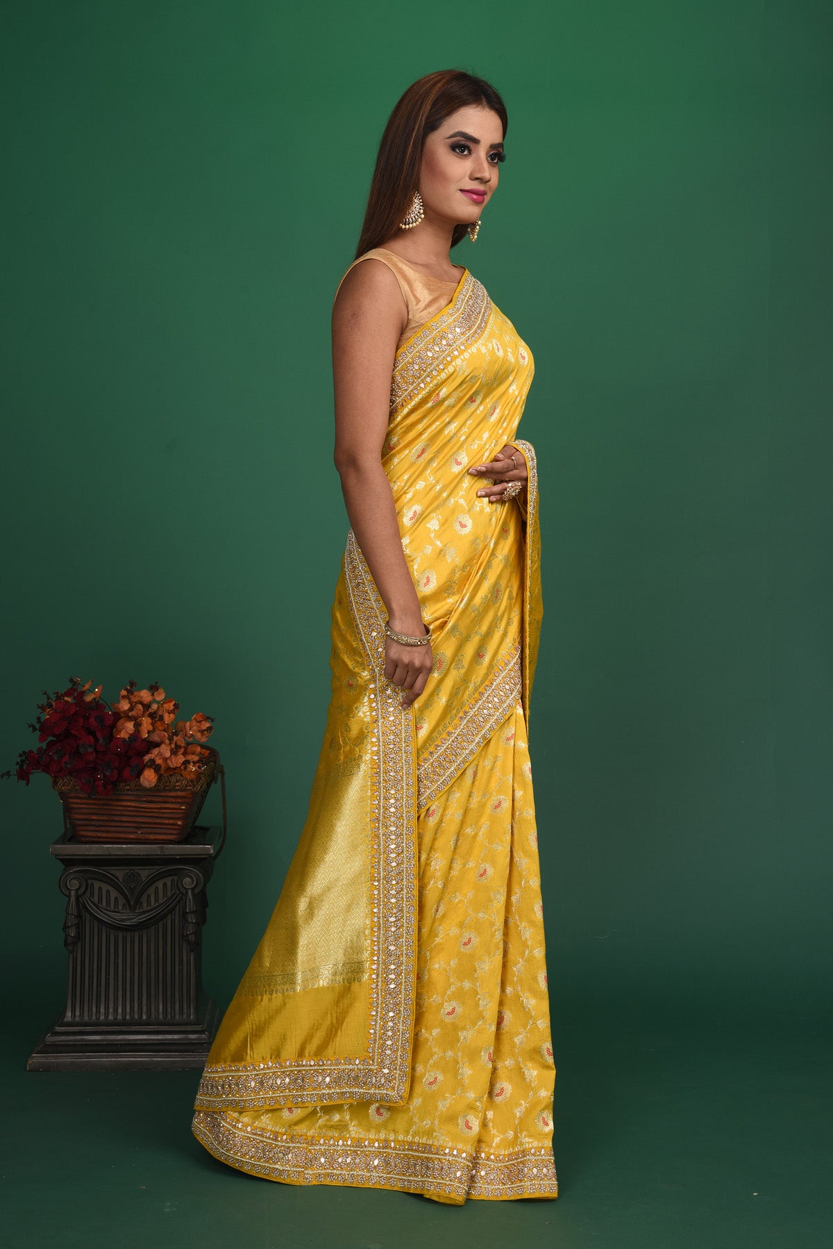 Buy stunning yellow Benarasi georgette saree online in USA with embroidered border. Be a vision of style and elegance at parties and special occasions in beautiful designer sarees, embroidered sarees, printed sarees, satin saris from Pure Elegance Indian fashion store in USA.-side