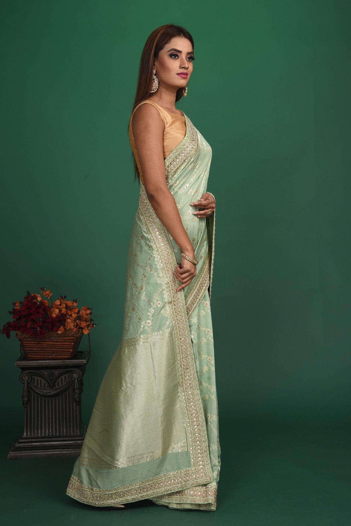 Buy beautiful pastel green Benarasi saree online in USA with embroidered border. Be a vision of style and elegance at parties and special occasions in beautiful designer sarees, embroidered sarees, printed sarees, satin saris from Pure Elegance Indian fashion store in USA.-side