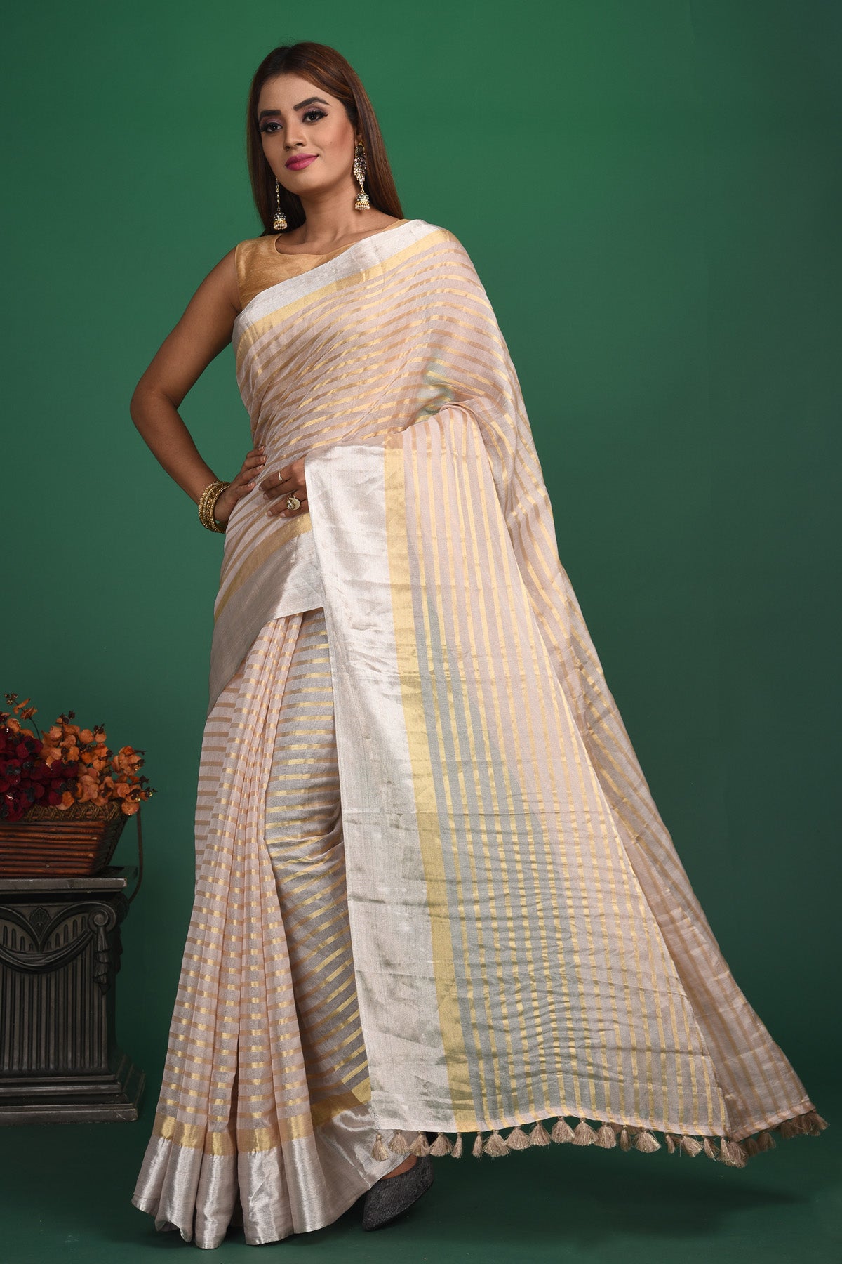 Shop beautiful cream tissue silk striped saree online in USA with designer blouse. Be a vision of style and elegance at parties and special occasions in beautiful designer sarees, embroidered sarees, printed sarees, satin saris from Pure Elegance Indian fashion store in USA.-full view