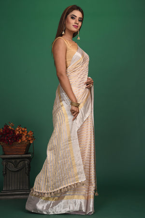 Shop beautiful cream tissue silk striped saree online in USA with designer blouse. Be a vision of style and elegance at parties and special occasions in beautiful designer sarees, embroidered sarees, printed sarees, satin saris from Pure Elegance Indian fashion store in USA.-side