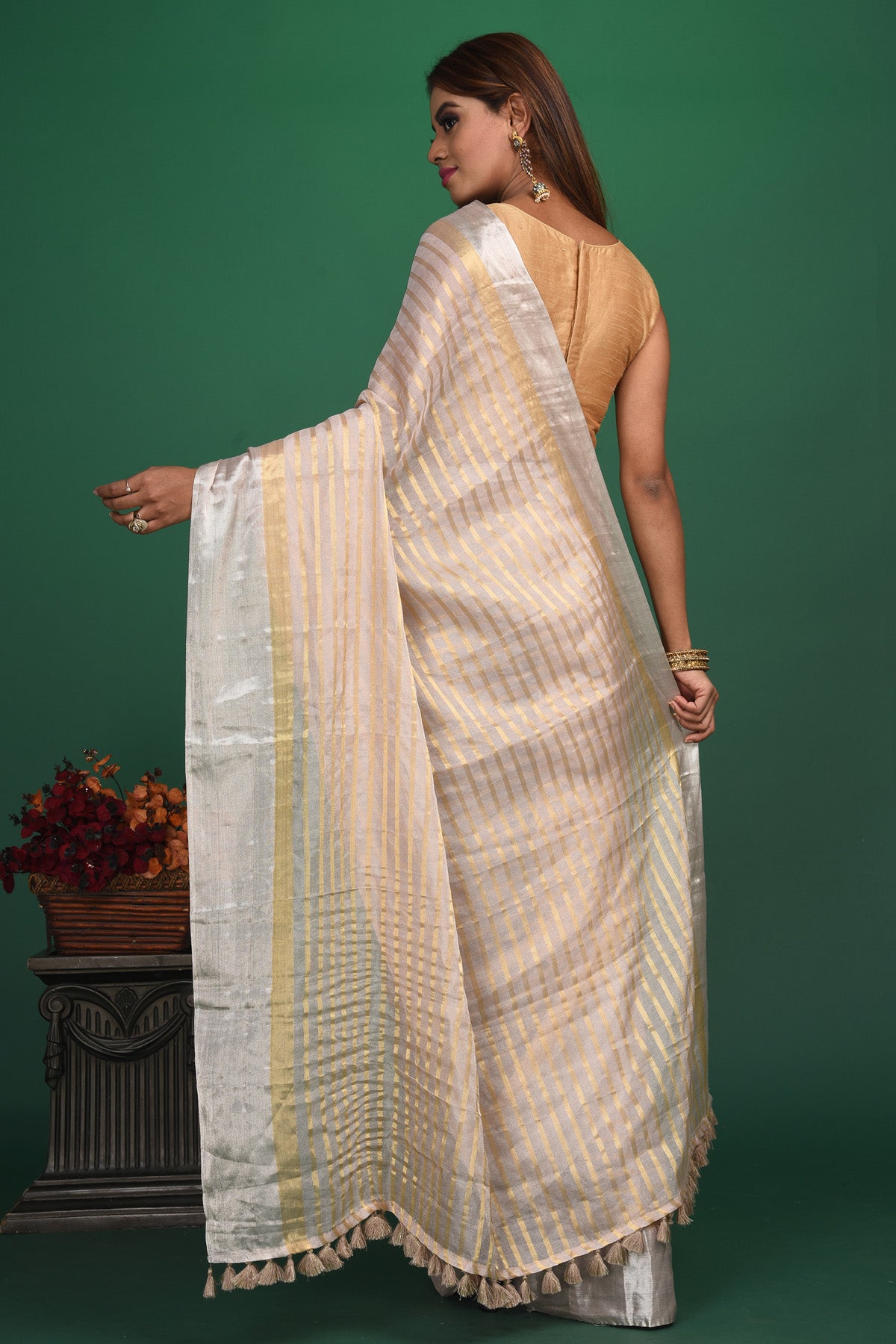 Shop beautiful cream tissue silk striped saree online in USA with designer blouse. Be a vision of style and elegance at parties and special occasions in beautiful designer sarees, embroidered sarees, printed sarees, satin saris from Pure Elegance Indian fashion store in USA.-back