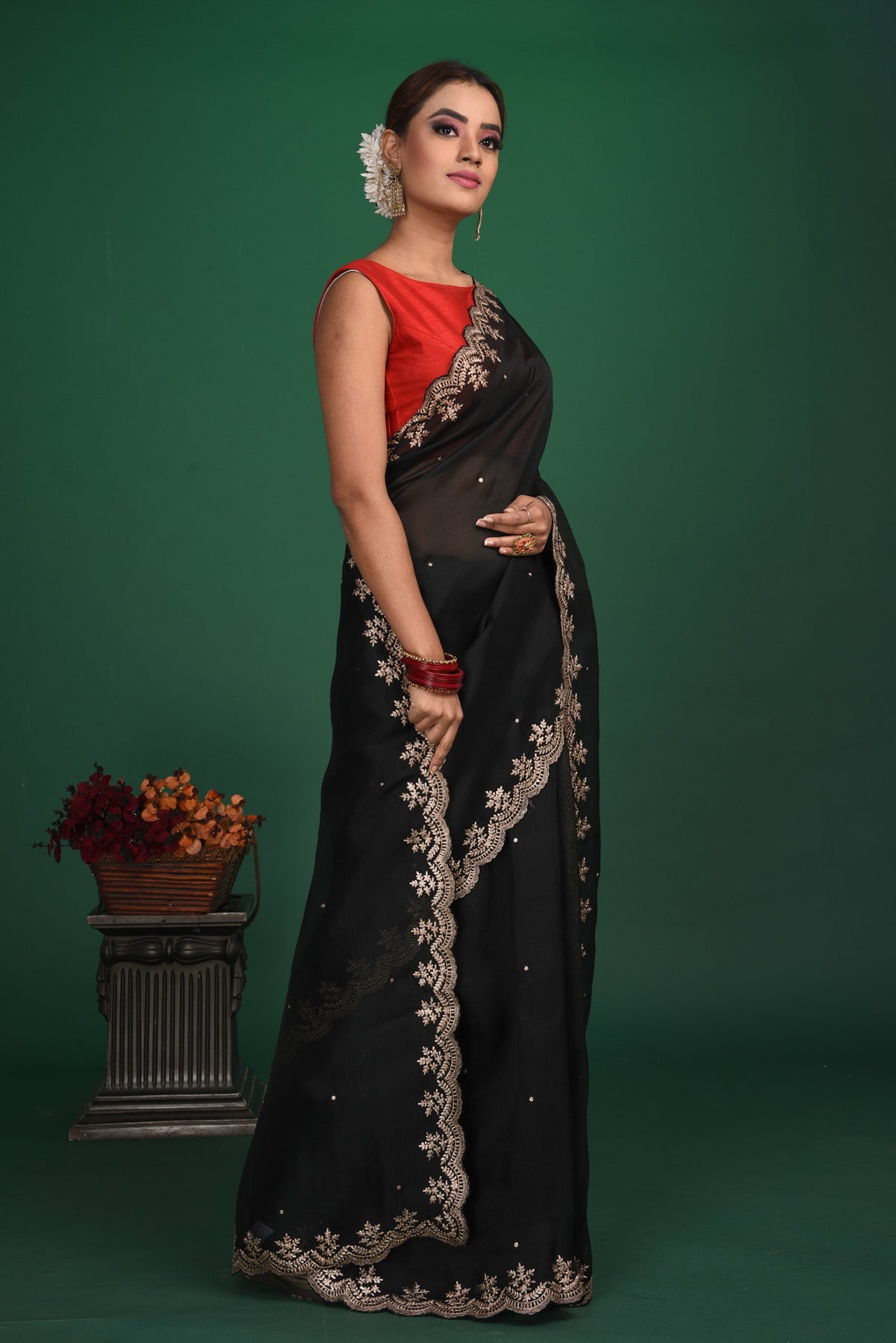 Shop beautiful black embroidered organza saree online in USA with designer blouse. Be a vision of style and elegance at parties and special occasions in beautiful designer sarees, embroidered sarees, printed sarees, satin saris from Pure Elegance Indian fashion store in USA.-side