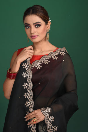 Shop beautiful black embroidered organza saree online in USA with designer blouse. Be a vision of style and elegance at parties and special occasions in beautiful designer sarees, embroidered sarees, printed sarees, satin saris from Pure Elegance Indian fashion store in USA.-closeup