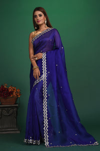 Buy beautiful royal blue embroidered organza saree online in USA. Be a vision of style and elegance at parties and special occasions in beautiful designer sarees, embroidered sarees, printed sarees, satin saris from Pure Elegance Indian fashion store in USA.-full view