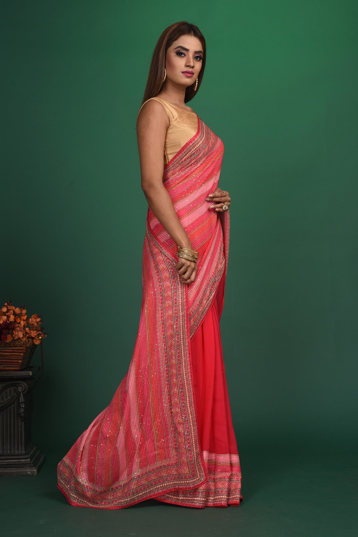 Shop stunning pink striped sequin georgette saree online in USA. Be a vision of style and elegance at parties and special occasions in beautiful designer sarees, embroidered sarees, printed sarees, satin saris from Pure Elegance Indian fashion store in USA.-side