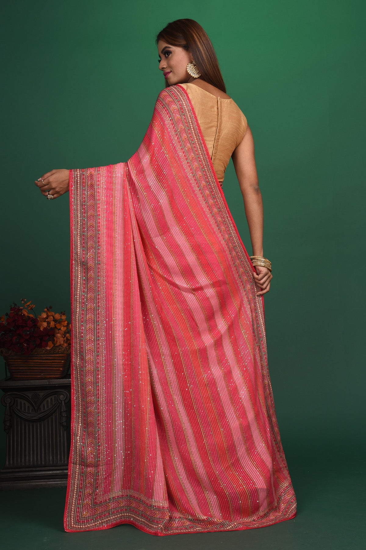 Shop stunning pink striped sequin georgette saree online in USA. Be a vision of style and elegance at parties and special occasions in beautiful designer sarees, embroidered sarees, printed sarees, satin saris from Pure Elegance Indian fashion store in USA.-back