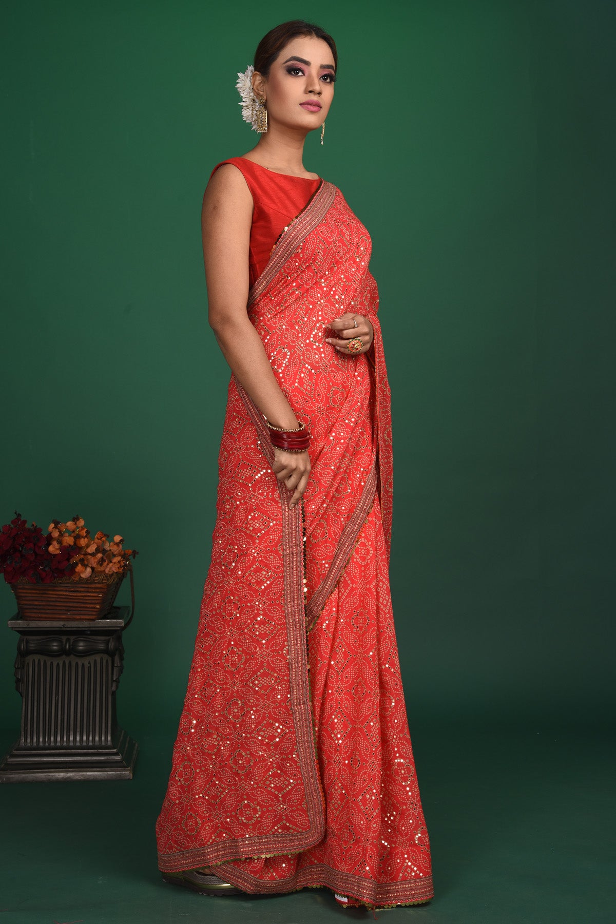 Shop stunning red bandhej and sequin georgette saree online in USA. Be a vision of style and elegance at parties and special occasions in beautiful designer sarees, embroidered sarees, printed sarees, satin saris from Pure Elegance Indian fashion store in USA.-side