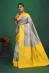 Shop grey printed Kanjeevaram saree online in USA with yellow border. Be a vision of style and elegance at parties and special occasions in beautiful designer sarees, embroidered sarees, printed sarees, satin saris from Pure Elegance Indian fashion store in USA.-full view