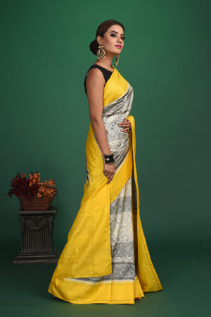 Shop grey printed Kanjeevaram saree online in USA with yellow border. Be a vision of style and elegance at parties and special occasions in beautiful designer sarees, embroidered sarees, printed sarees, satin saris from Pure Elegance Indian fashion store in USA.-side