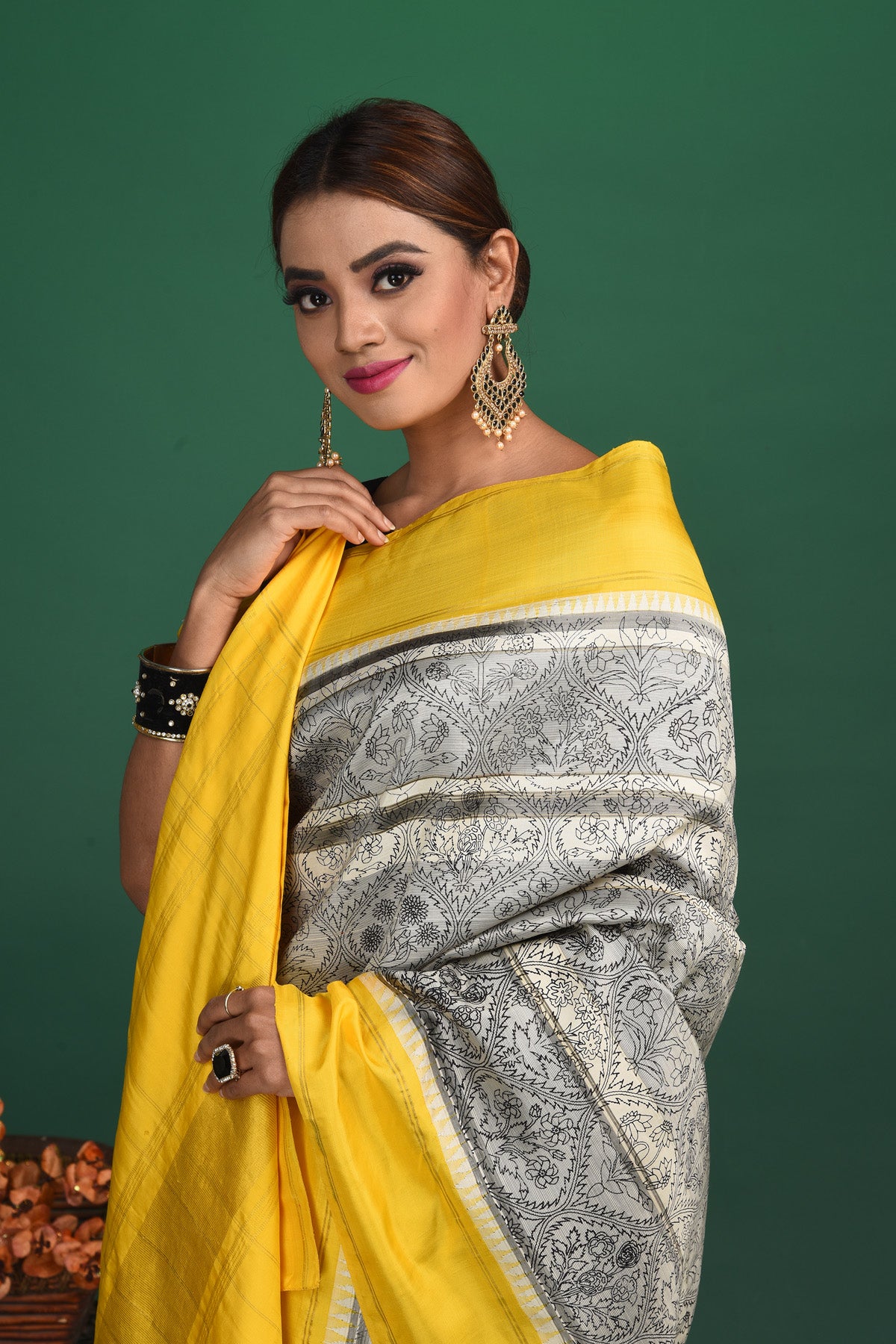 Shop grey printed Kanjeevaram saree online in USA with yellow border. Be a vision of style and elegance at parties and special occasions in beautiful designer sarees, embroidered sarees, printed sarees, satin saris from Pure Elegance Indian fashion store in USA.-closeup
