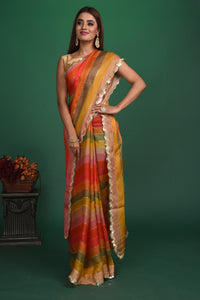 Shop multicolor stripes georgette sari online in USA with sequin scalloped border. Be a vision of style and elegance at parties and special occasions in beautiful designer sarees, embroidered sarees, printed sarees, satin saris from Pure Elegance Indian fashion store in USA.-full view