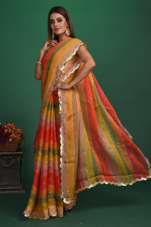 Shop multicolor stripes georgette sari online in USA with sequin scalloped border. Be a vision of style and elegance at parties and special occasions in beautiful designer sarees, embroidered sarees, printed sarees, satin saris from Pure Elegance Indian fashion store in USA.-pallu