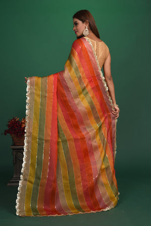 Shop multicolor stripes georgette sari online in USA with sequin scalloped border. Be a vision of style and elegance at parties and special occasions in beautiful designer sarees, embroidered sarees, printed sarees, satin saris from Pure Elegance Indian fashion store in USA.-back