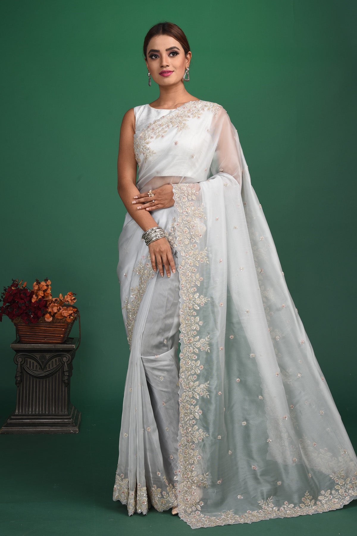 Buy beautiful white organza sari online in USA with embroidered border. Be a vision of style and elegance at parties and special occasions in beautiful designer sarees, embroidered sarees, printed sarees, satin saris from Pure Elegance Indian fashion store in USA.-full view
