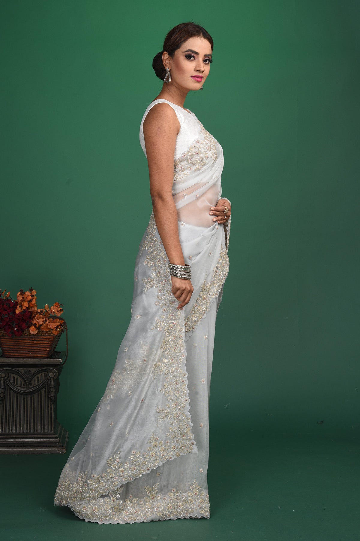 Buy beautiful white organza sari online in USA with embroidered border. Be a vision of style and elegance at parties and special occasions in beautiful designer sarees, embroidered sarees, printed sarees, satin saris from Pure Elegance Indian fashion store in USA.-side\