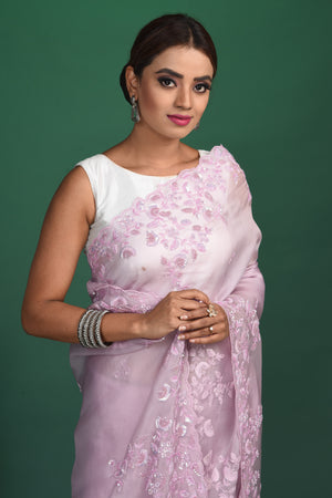 Shop stunning lavender organza sari online in USA with embroidered border. Be a vision of style and elegance at parties and special occasions in beautiful designer sarees, embroidered sarees, printed sarees, satin saris from Pure Elegance Indian fashion store in USA.-closeup