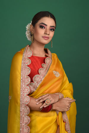 Shop stunning mango yellow embroidered organza saree online in USA. Be a vision of style and elegance at parties and special occasions in beautiful designer sarees, embroidered sarees, printed sarees, satin saris from Pure Elegance Indian fashion store in USA.-closeup