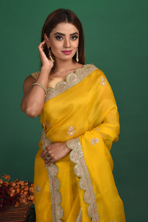 Buy stunning mango yellow embroidered organza saree online in USA. Be a vision of style and elegance at parties and special occasions in beautiful designer sarees, embroidered sarees, printed sarees, satin saris from Pure Elegance Indian fashion store in USA.-closeup