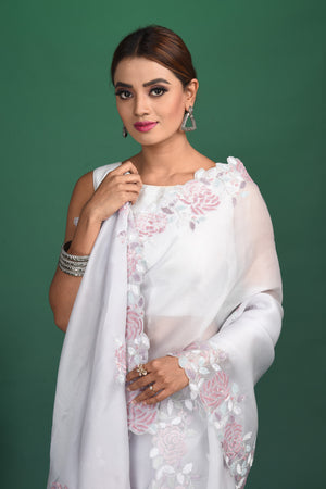 Buy stunning white embroidered organza saree online in USA. Be a vision of style and elegance at parties and special occasions in beautiful designer sarees, embroidered sarees, printed sarees, satin saris from Pure Elegance Indian fashion store in USA.-closeup