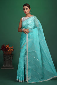 Buy stunning turquoise blue embroidered organza saree online in USA. Be a vision of style and elegance at parties and special occasions in beautiful designer sarees, embroidered sarees, printed sarees, satin saris from Pure Elegance Indian fashion store in USA.-full view