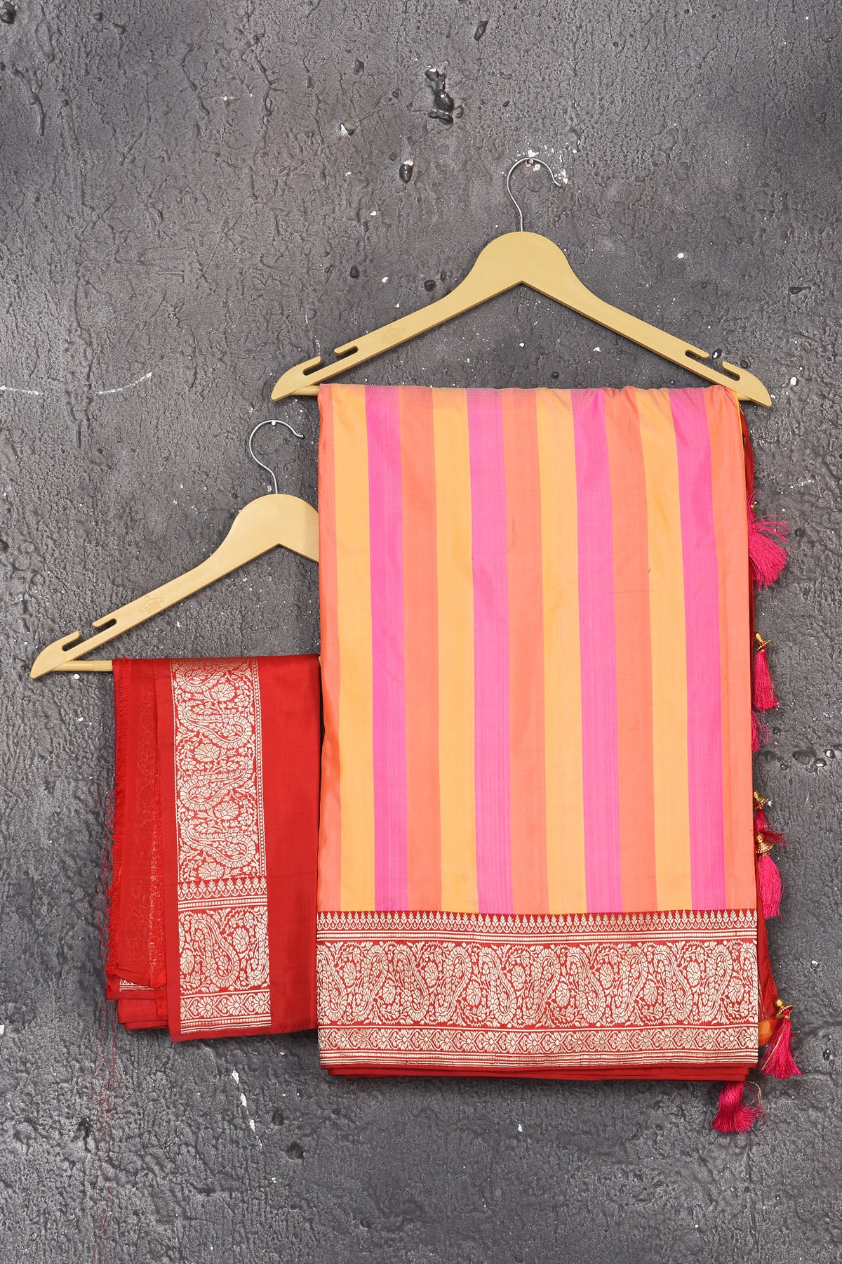Buy this classy red banarasi silk brocade woven diagonal stripes and floral saree online in USA which has beautiful zari work all over the heavy border and end with handmade latkan. Pair this royal banarasi handloom brocade woven saree with your designer blouse and a potli bag from Pure Elegance Indian fashion store in USA.- Unstitched blouse.