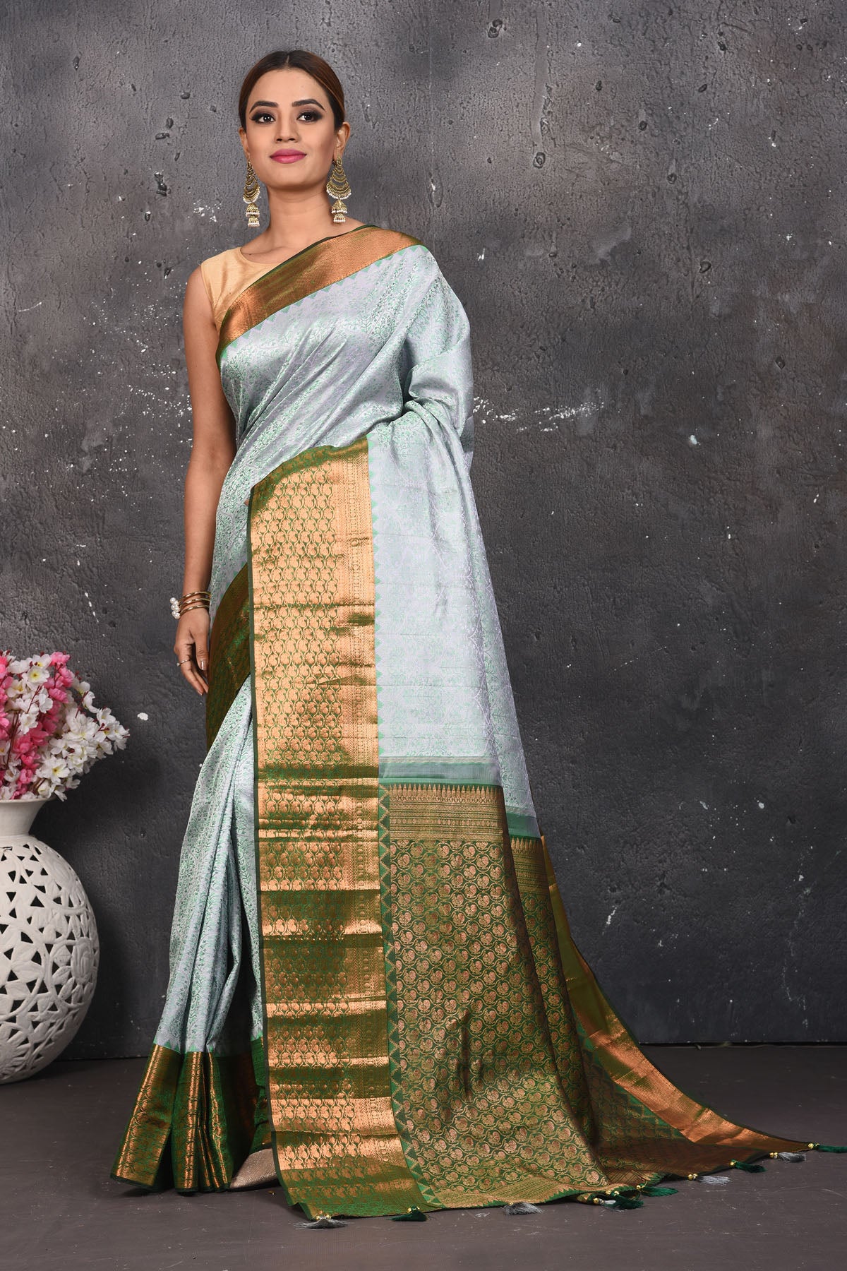 Buy beautiful handloom kanchipuram silk saree adorned with antique zari buta work online in USA which has crafted by skilled weaver with elegance and grace, this saree is definitely the epitome of beauty and a must have in your collection. Buy designer handwoven kanchipuram sari with any blouse from Pure Elegance Indian saree store in USA.- Full view.