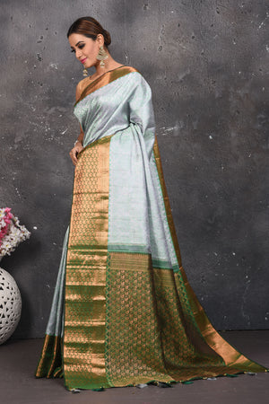 Buy beautiful handloom kanchipuram silk saree adorned with antique zari buta work online in USA which has crafted by skilled weaver with elegance and grace, this saree is definitely the epitome of beauty and a must have in your collection. Buy designer handwoven kanchipuram sari with any blouse from Pure Elegance Indian saree store in USA.- Side view.