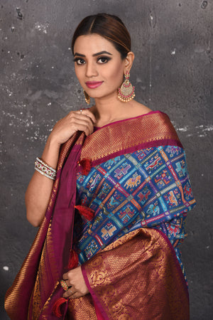 Buy this royal banarasi silk saree with pashmina weaving adorned with antique zari work online in USA which has crafted by skilled weaver of Banaras with elegance and grace, this saree is definitely the epitome of beauty and a must have in your collection. Buy designer handwoven banarasi pashmina sari with any blouse from Pure Elegance Indian saree store in USA.- Close up.