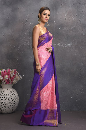 Buy this elegant purple and pink sequins georgette saree with heavy golden zari border online in USA. Create and establish a smashing influence on everybody by carrying this designer sequin georgette saree with your designer blouse. Shop designer sequins georgette with heavy border from Pure Elegance Indian saree store in USA.- Side view.