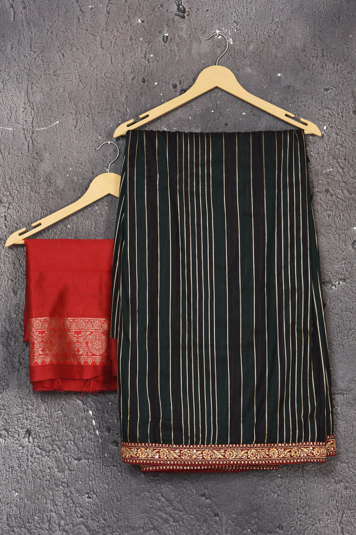 Buy this elegant black saree leheriya with gota patti work online in USA. Style this designer sari which has a beautiful red border with golden lace at the edge with a potli bag and high heels. Add designer gota patti sari to your collection from Pure Elegance Indian saree store in USA.- Unstitched red blouse.
