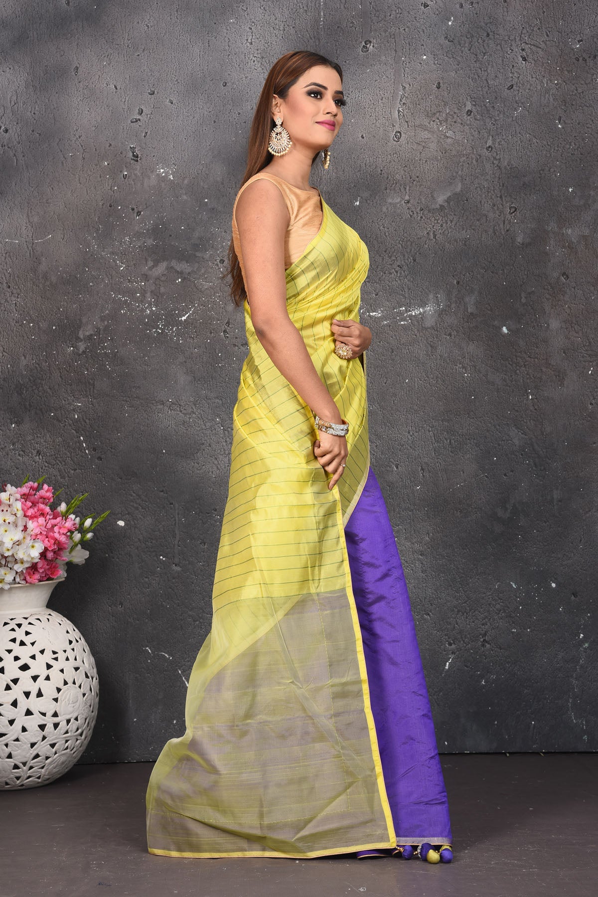 Shop stunning blue and yellow striped matka silk sari online in USA. Keep your ethnic wardrobe up to date with latest designer sarees, pure silk sarees, Kanchipuram silk sarees, handwoven saris, tussar silk sarees, embroidered saris from Pure Elegance Indian saree store in USA.-side