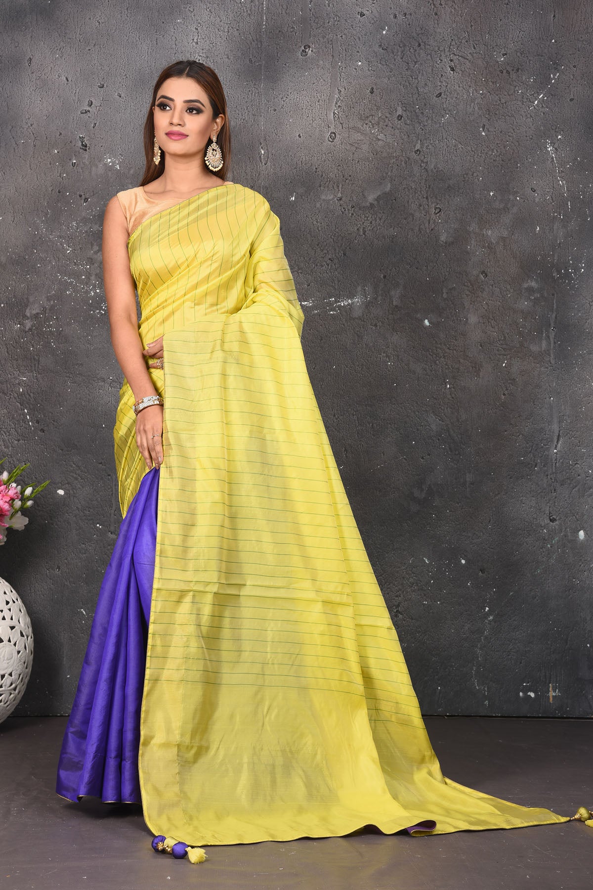 Shop stunning yellow and blue striped matka silk saree online in USA. Keep your ethnic wardrobe up to date with latest designer sarees, pure silk sarees, Kanchipuram silk sarees, handwoven saris, tussar silk sarees, embroidered saris from Pure Elegance Indian saree store in USA.-full view