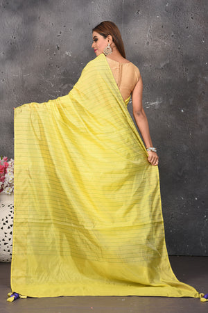 Shop stunning yellow and blue striped matka silk saree online in USA. Keep your ethnic wardrobe up to date with latest designer sarees, pure silk sarees, Kanchipuram silk sarees, handwoven saris, tussar silk sarees, embroidered saris from Pure Elegance Indian saree store in USA.-back