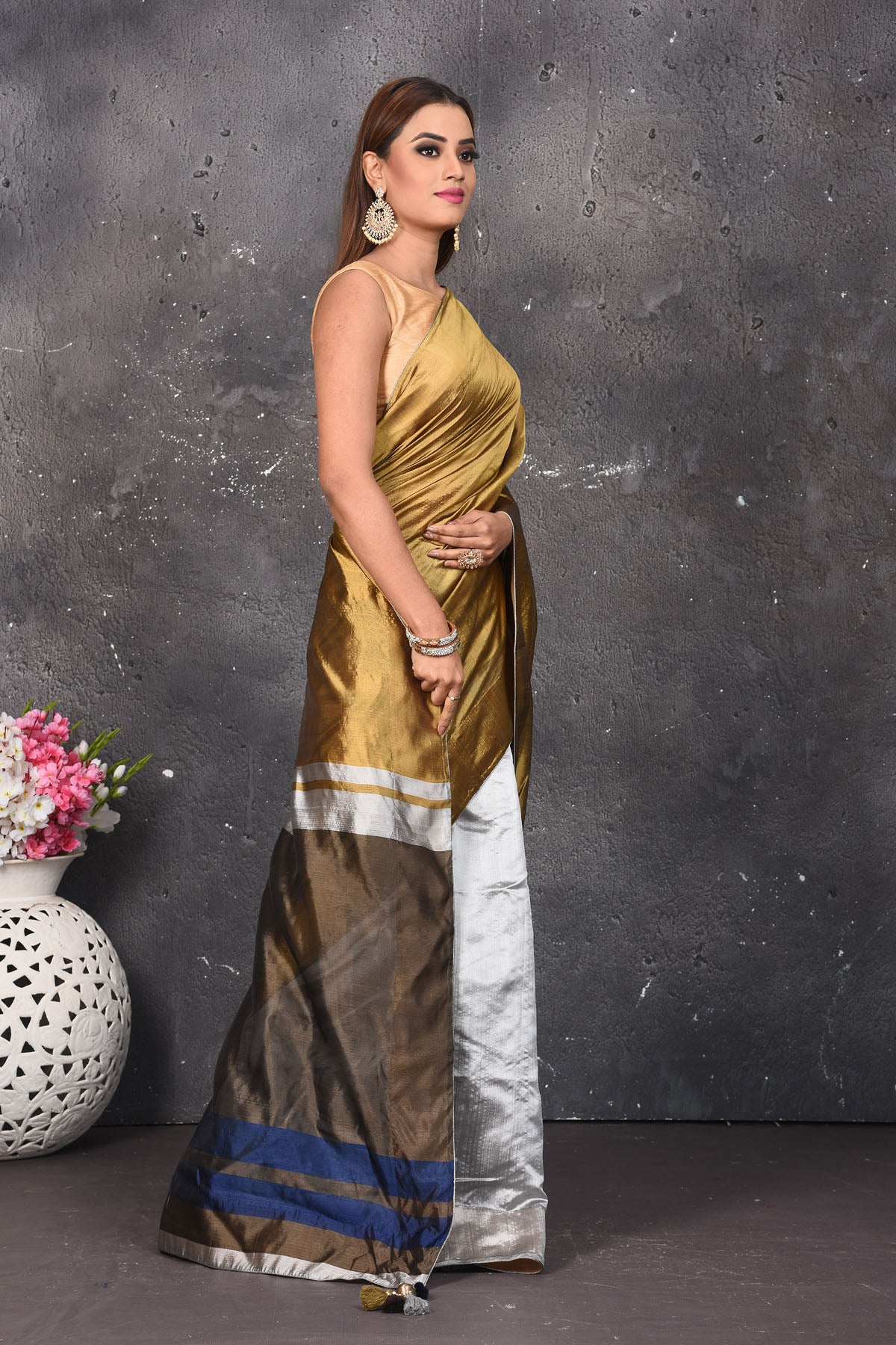 Shop stunning golden and silver matka silk saree online in USA. Keep your ethnic wardrobe up to date with latest designer sarees, pure silk sarees, Kanchipuram silk sarees, handwoven saris, tussar silk sarees, embroidered saris from Pure Elegance Indian saree store in USA.-side
