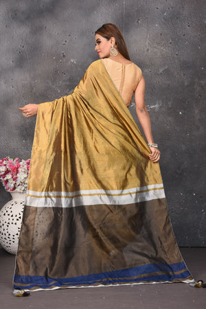 Shop stunning golden and silver matka silk saree online in USA. Keep your ethnic wardrobe up to date with latest designer sarees, pure silk sarees, Kanchipuram silk sarees, handwoven saris, tussar silk sarees, embroidered saris from Pure Elegance Indian saree store in USA.-back