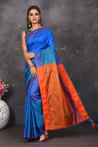 Shop stunning blue matka silk saree online in USA with orange pallu. Keep your ethnic wardrobe up to date with latest designer sarees, pure silk sarees, Kanchipuram silk sarees, handwoven saris, tussar silk sarees, embroidered saris from Pure Elegance Indian saree store in USA.-full view