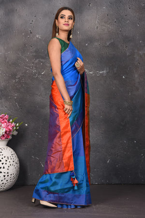 Shop stunning blue matka silk saree online in USA with orange pallu. Keep your ethnic wardrobe up to date with latest designer sarees, pure silk sarees, Kanchipuram silk sarees, handwoven saris, tussar silk sarees, embroidered saris from Pure Elegance Indian saree store in USA.-side