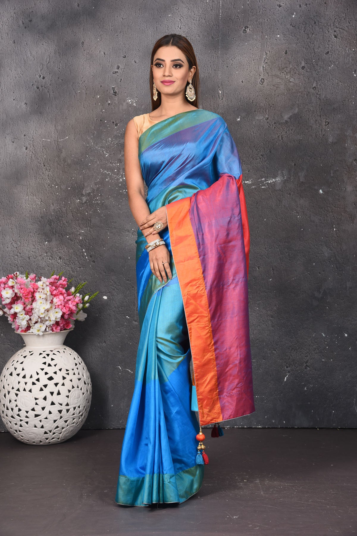 Shop stunning blue matka silk saree online in USA with orange and purple pallu. Keep your ethnic wardrobe up to date with latest designer sarees, pure silk sarees, Kanchipuram silk sarees, handwoven saris, tussar silk sarees, embroidered saris from Pure Elegance Indian saree store in USA.-full view