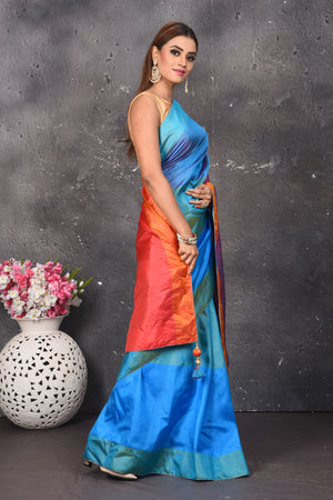 Shop stunning blue matka silk saree online in USA with orange and purple pallu. Keep your ethnic wardrobe up to date with latest designer sarees, pure silk sarees, Kanchipuram silk sarees, handwoven saris, tussar silk sarees, embroidered saris from Pure Elegance Indian saree store in USA.-side