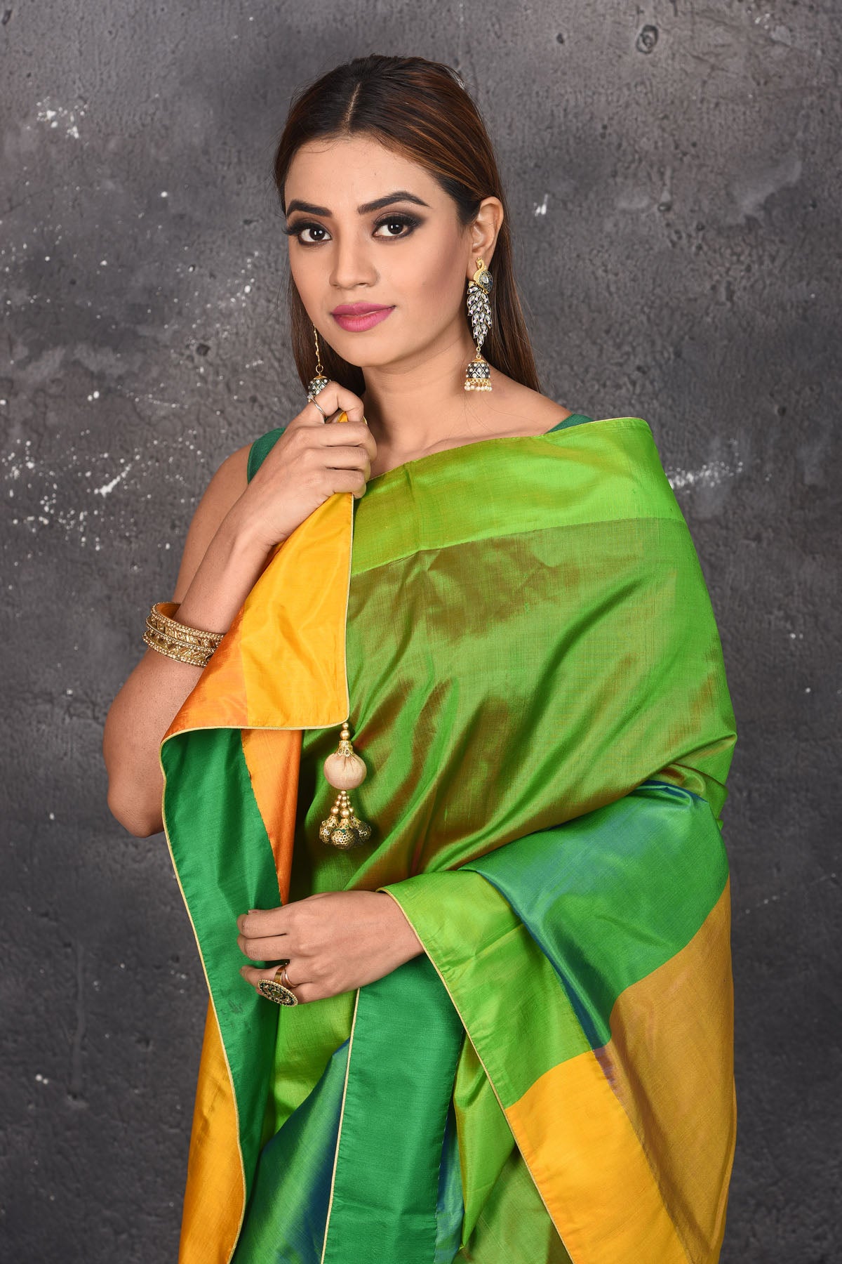 Buy stunning green matka silk saree online in USA with yellow pallu. Keep your ethnic wardrobe up to date with latest designer sarees, pure silk sarees, Kanchipuram silk sarees, handwoven saris, tussar silk sarees, embroidered saris from Pure Elegance Indian saree store in USA.-closeup