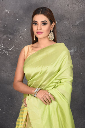Shop beautiful pastel green and pink matka silk sari online in USA with yellow pallu. Keep your ethnic wardrobe up to date with latest designer sarees, pure silk sarees, Kanchipuram silk sarees, handwoven saris, tussar silk sarees, embroidered saris from Pure Elegance Indian saree store in USA.-closeup