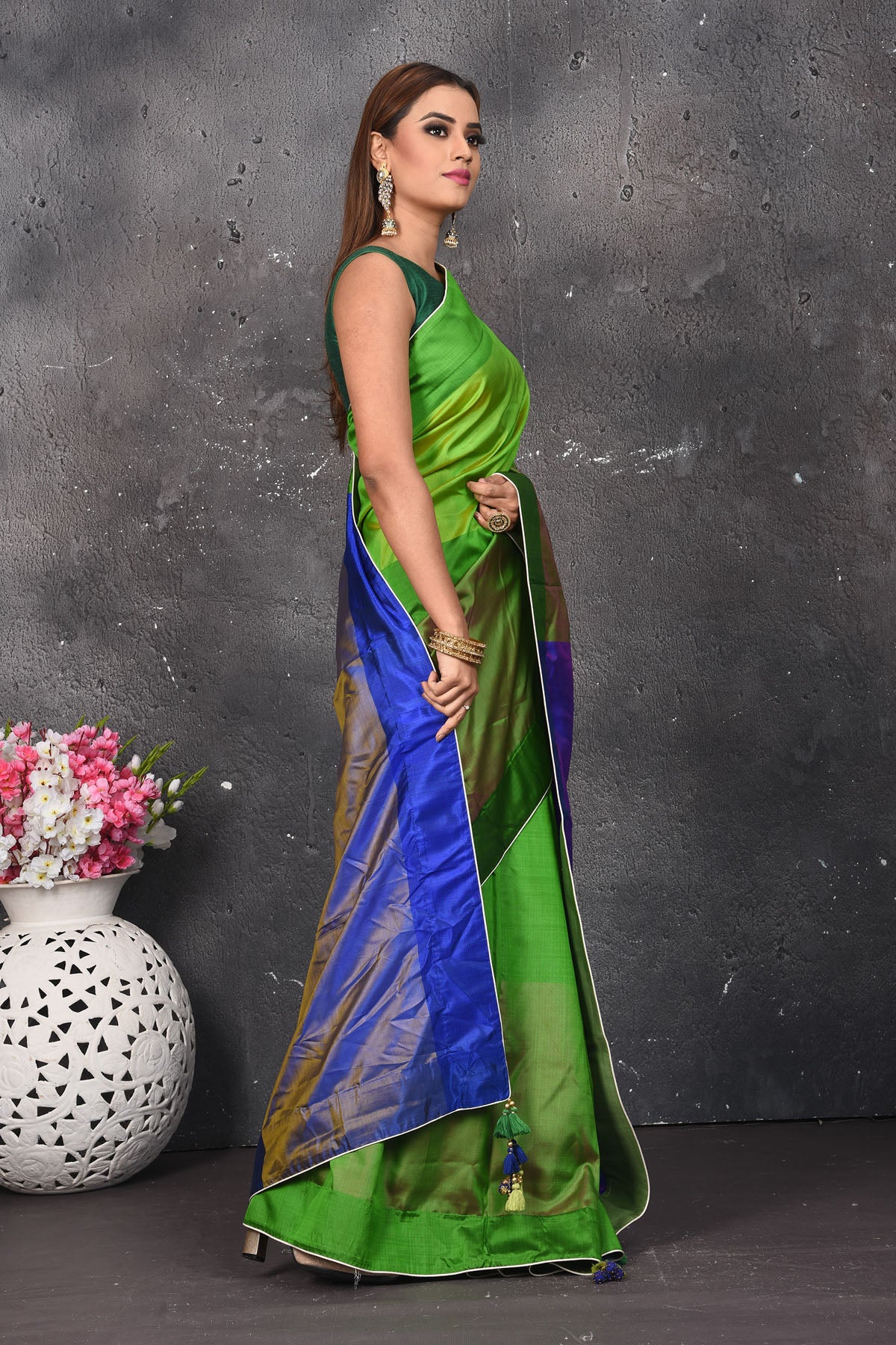 Shop beautiful light green matka silk sari online in USA with blue zari pallu. Keep your ethnic wardrobe up to date with latest designer sarees, pure silk sarees, Kanchipuram silk sarees, handwoven saris, tussar silk sarees, embroidered saris from Pure Elegance Indian saree store in USA.-side
