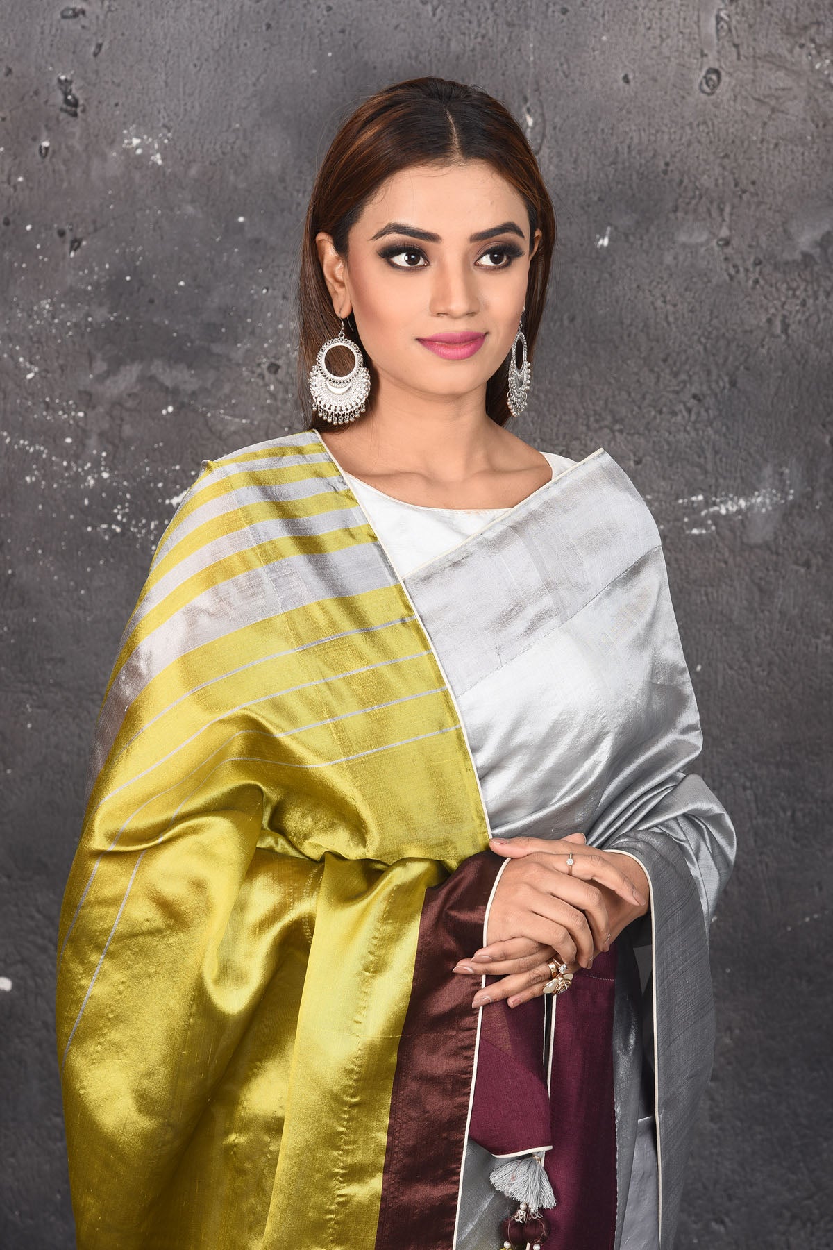 Shop stunning grey and brown matka silk saree online in USA with green pallu. Keep your ethnic wardrobe up to date with latest designer sarees, pure silk sarees, Kanchipuram silk sarees, handwoven saris, tussar silk sarees, embroidered saris from Pure Elegance Indian saree store in USA.-closeup
