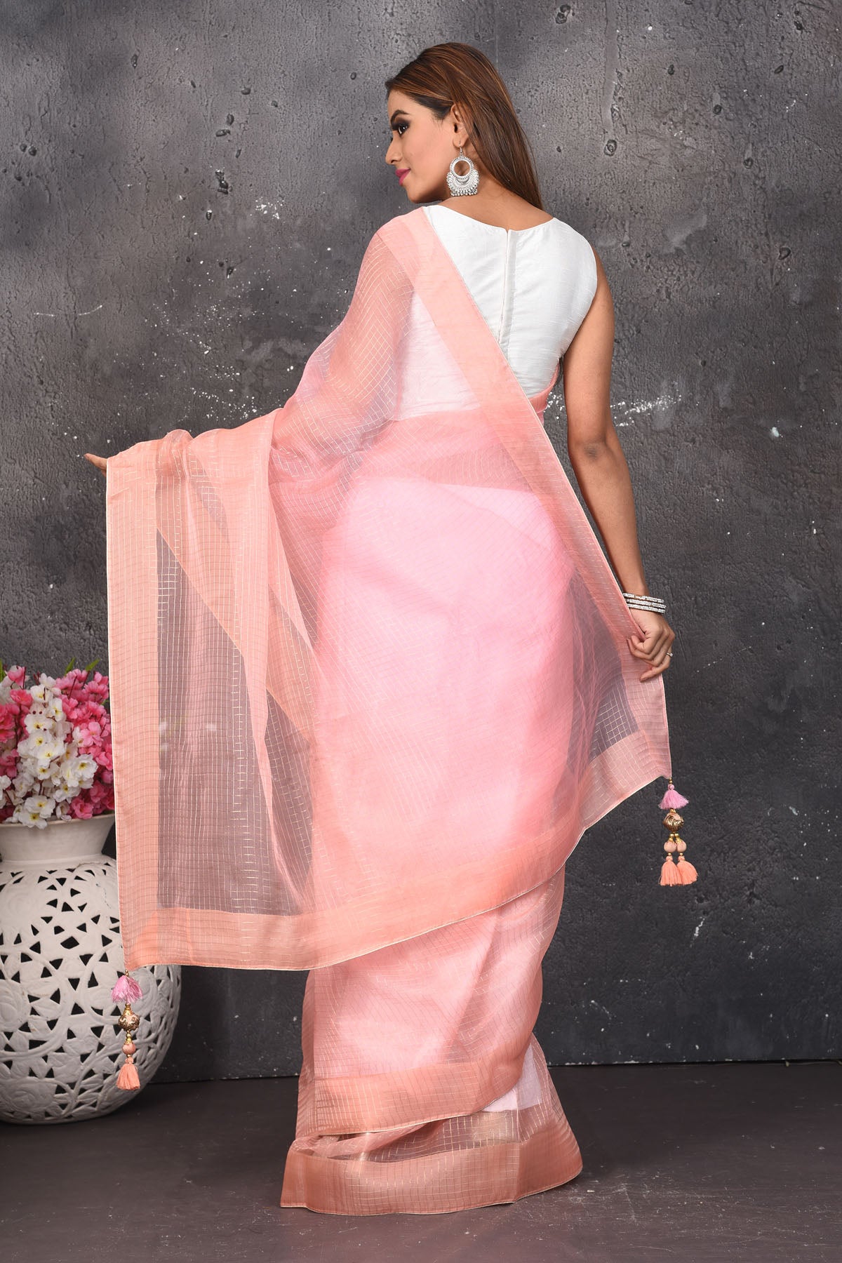 Shop beautiful light pink striped organza saree online in USA. Keep your ethnic wardrobe up to date with latest designer sarees, pure silk sarees, Kanchipuram silk sarees, handwoven saris, tussar silk sarees, embroidered saris from Pure Elegance Indian saree store in USA.-back