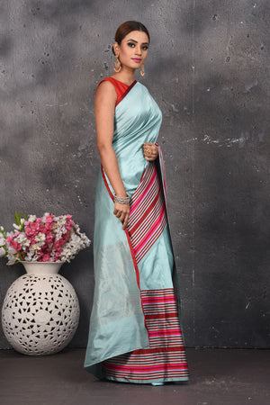 Shop beautiful light blue Mashru silk saree online in USA with striped pallu. Be the center of attraction on special occasions in stunning silk sarees, handloom sarees, embroidered sarees, designer sarees, Bollywood sarees from Pure Elegance Indian fashion store in USA.-side