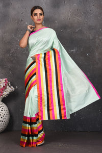 Buy stunning mint green Mashru silk sari online in USA with multicolor stripes border. Be the center of attraction on special occasions in stunning silk sarees, handloom sarees, embroidered sarees, designer sarees, Bollywood sarees from Pure Elegance Indian fashion store in USA.-full view