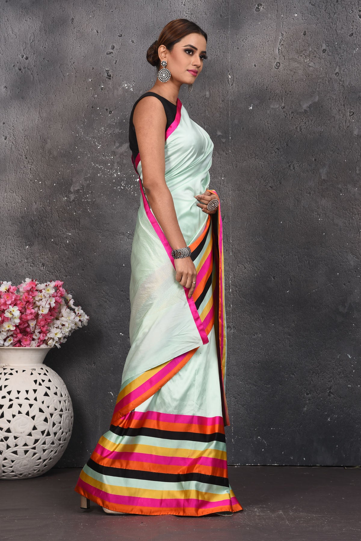 Buy stunning mint green Mashru silk sari online in USA with multicolor stripes border. Be the center of attraction on special occasions in stunning silk sarees, handloom sarees, embroidered sarees, designer sarees, Bollywood sarees from Pure Elegance Indian fashion store in USA.-side