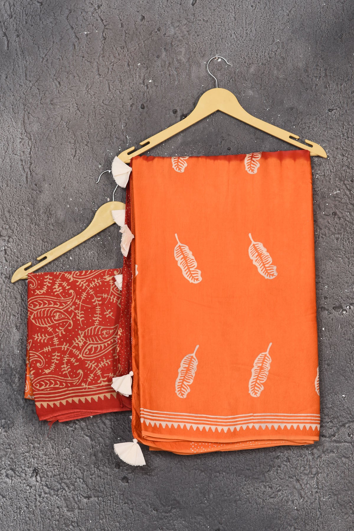 Shop stunning orange and red printed modal silk sari online in USA. Be the center of attraction on special occasions in stunning silk sarees, handloom sarees, embroidered sarees, designer sarees, Bollywood sarees from Pure Elegance Indian fashion store in USA.-blouse