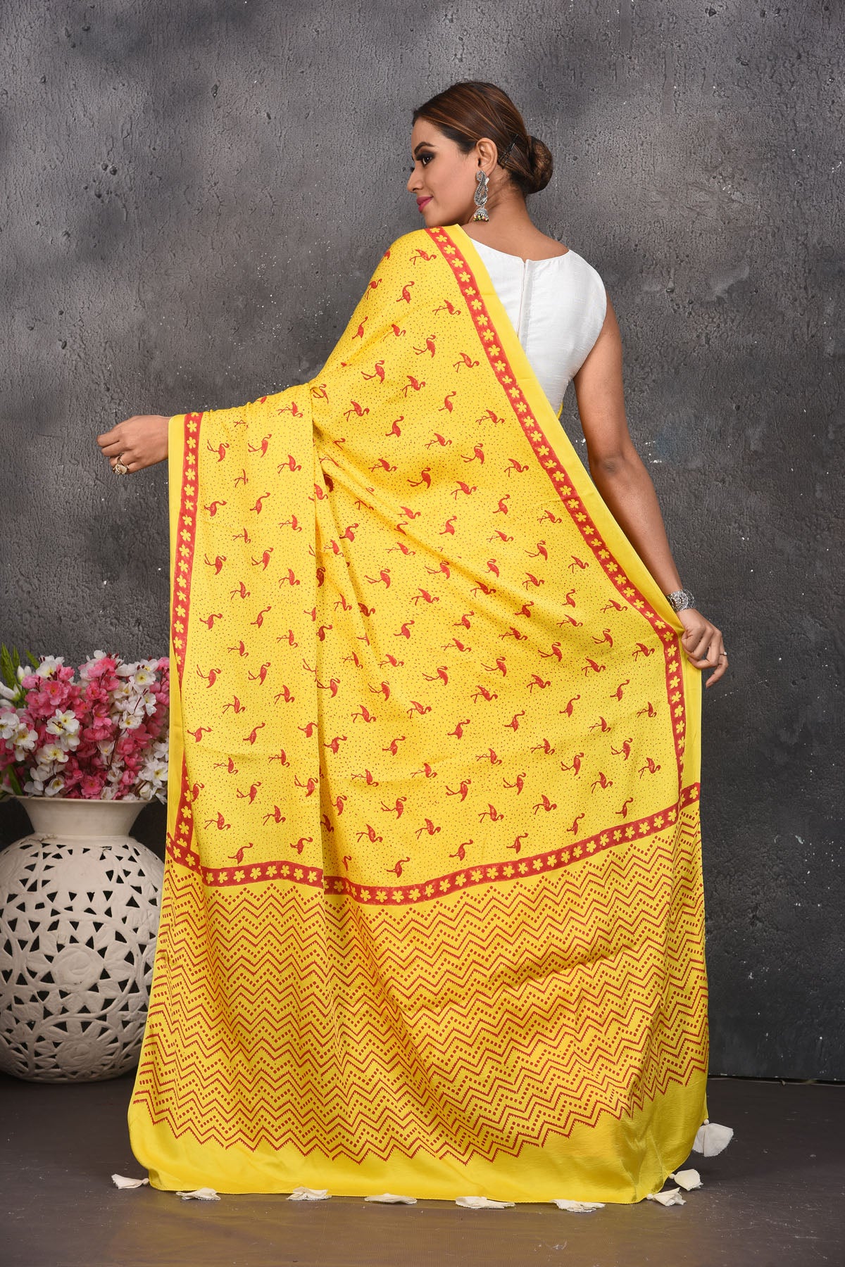 Shop stunning yellow and red printed modal silk sari online in USA. Be the center of attraction on special occasions in stunning silk sarees, handloom sarees, embroidered sarees, designer sarees, Bollywood sarees from Pure Elegance Indian fashion store in USA.-back