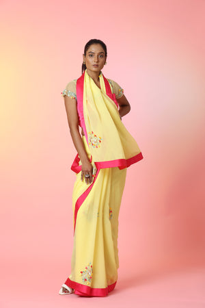 Shop beautiful yellow embroidered georgette saree online in USA with pink saree blouse. Look perfect in ethnic style on special occasions in beautiful designer sarees, embroidered sarees, party sarees, Bollywood sarees, handloom sarees from Pure Elegance Indian saree store in USA.-front